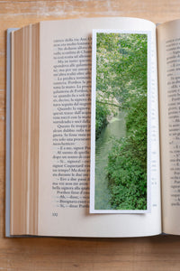 Secret Jungle fine art bookmark resting in an open book, close-up