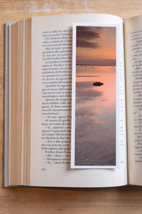Silent Low Tide fine art bookmark resting in an open book, close-up