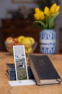 Snowy Chapel fine art bookmark styled with a dark book and fresh fruit