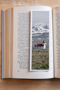 Snowy Chapel fine art bookmark resting in an open book, close-up