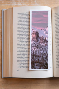 Snowy Dawn fine art bookmark resting in an open book, close-up