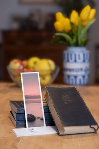 Soft Evening fine art bookmark styled with a dark book and fresh fruit