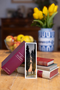 Soft Radiance fine art bookmark beside a stack of vintage books