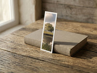 Spring Reflections fine art bookmark resting on a linen-bound book in soft window light