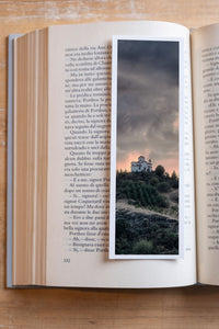 Stormy Sanctuary fine art bookmark resting in an open book, close-up