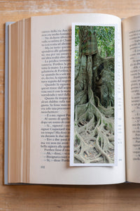 Strong Roots fine art bookmark resting in an open book, close-up