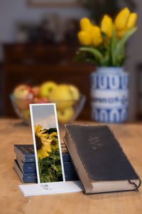 Summer Sunflowers fine art bookmark styled with a dark book and fresh fruit