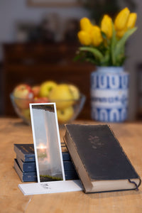 Sunset Curtain fine art bookmark styled with a dark book and fresh fruit