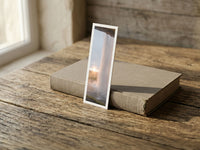 Sunset Curtain fine art bookmark resting on a linen-bound book in soft window light
