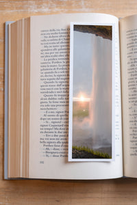Sunset Curtain fine art bookmark resting in an open book, close-up