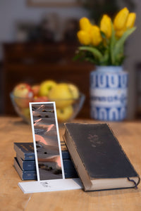 The Empty Quarter fine art bookmark styled with a dark book and fresh fruit
