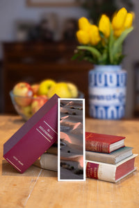 The Empty Quarter fine art bookmark beside a stack of vintage books