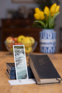 Turquoise Cascade fine art bookmark styled with a dark book and fresh fruit