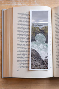 Wave Gate fine art bookmark resting in an open book, close-up