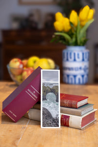 Wave Gate fine art bookmark beside a stack of vintage books