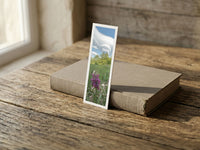 Wild Orchid fine art bookmark resting on a linen-bound book in soft window light
